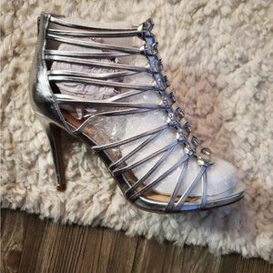 New in box/ NWT. Silver high heel strappy sandals. Women’s size 10